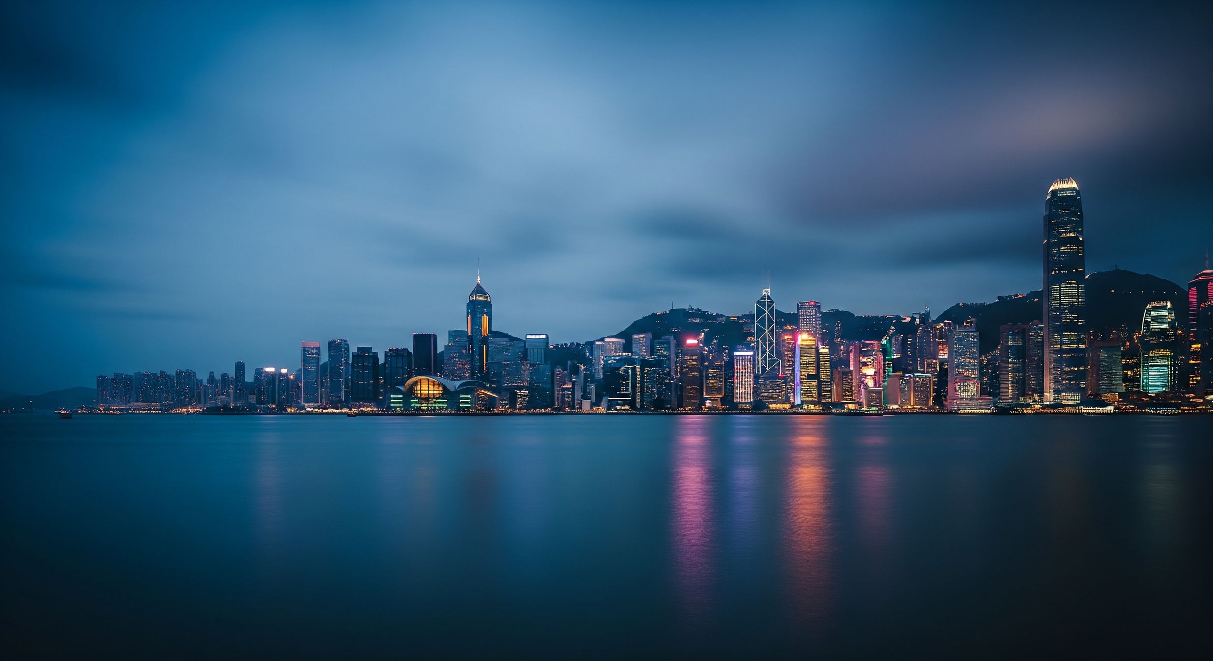 Hong Kong harbour at dusk in deep navy tones